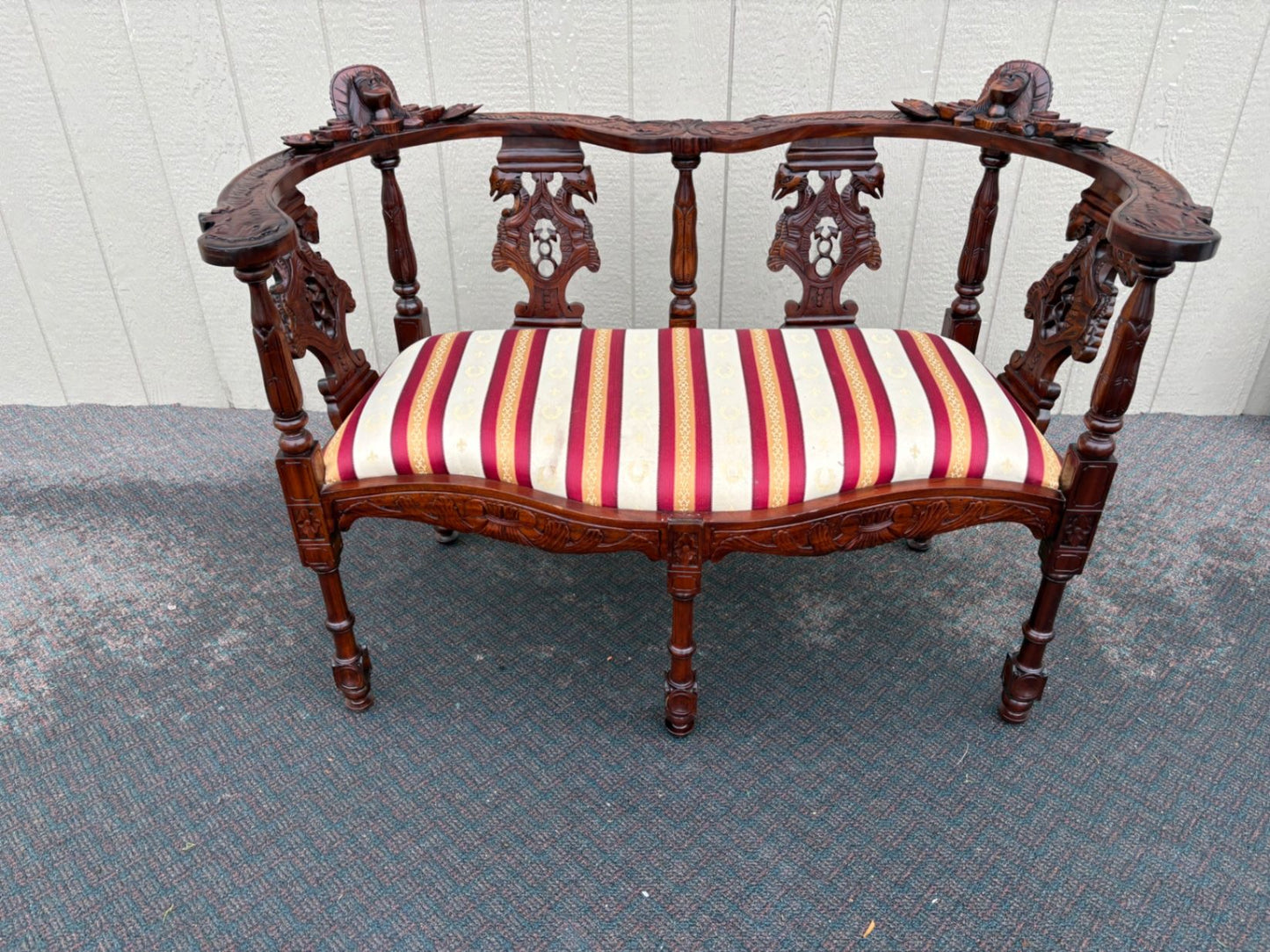 67469  Victorian  Style Carved Mahogany Settee with Figural Details and Upholstery