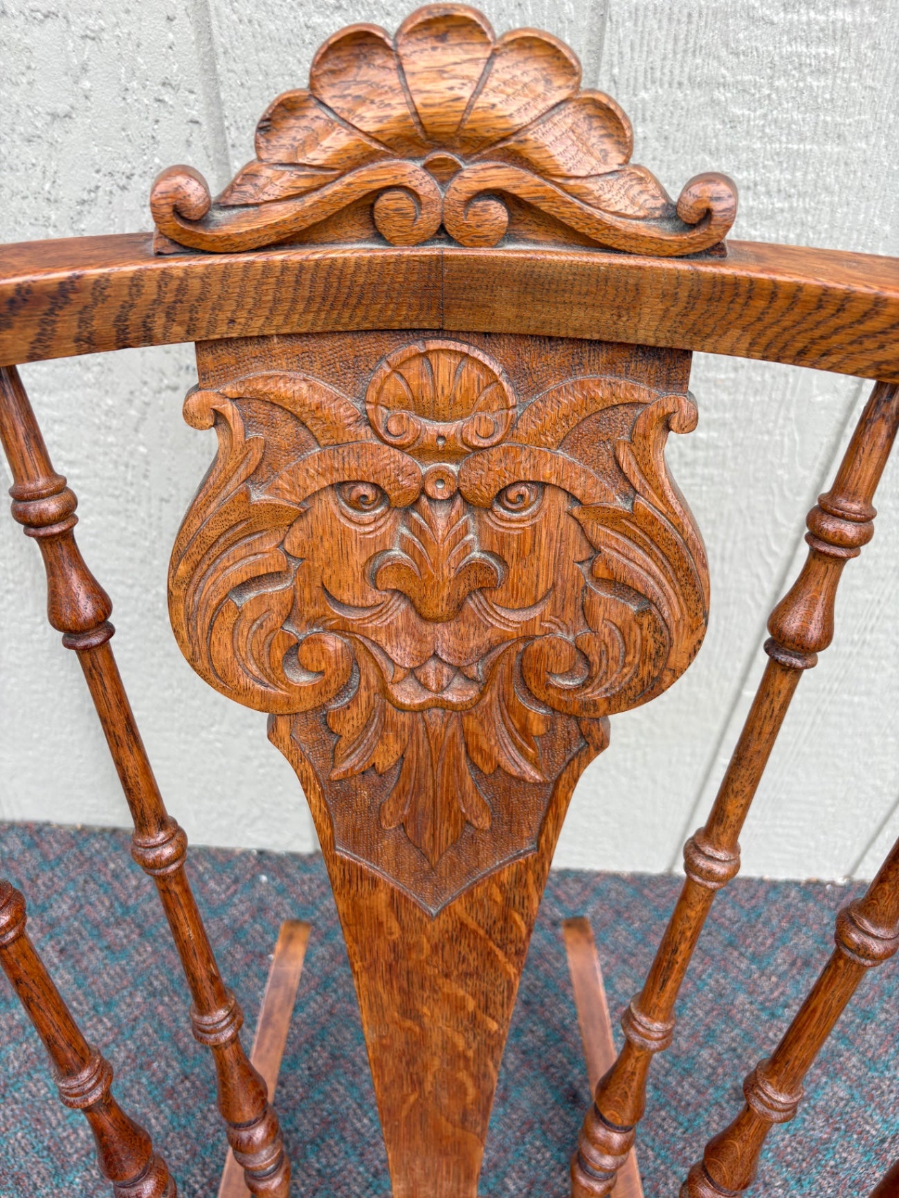 Antique Oak Lion's Head Carved Rocking Chair with Spindle Back
