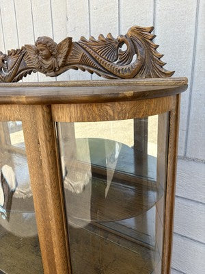 66656   Antique Victorian  Bow Glass Curio Cabinet with Angel Cherub Backsplash