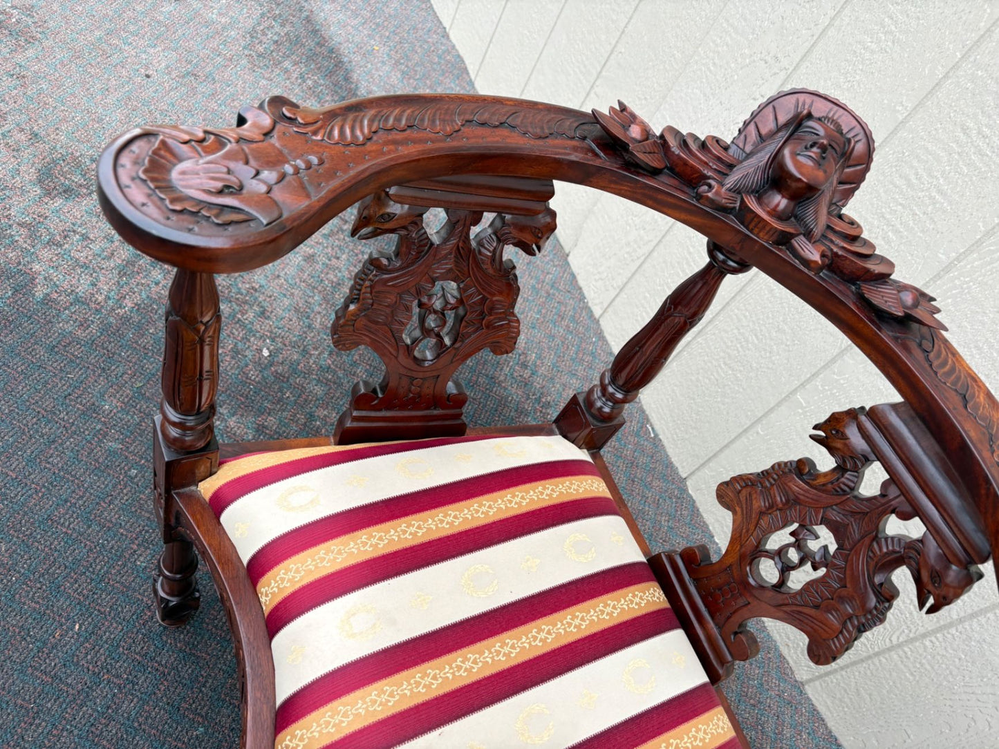 67469  Victorian  Style Carved Mahogany Settee with Figural Details and Upholstery