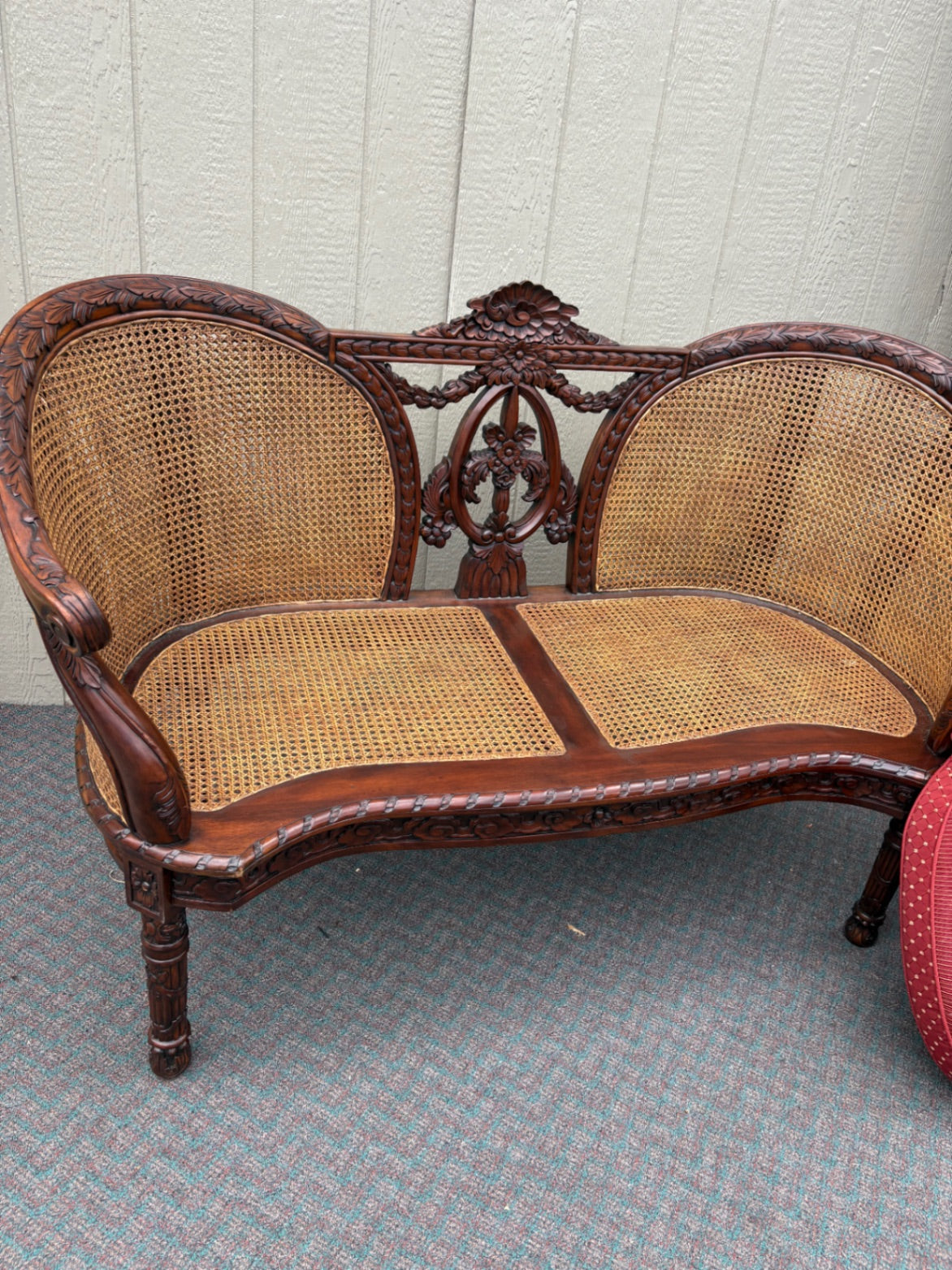 Victorian Carved Wood Settee with Caned Back and Red Cushion
