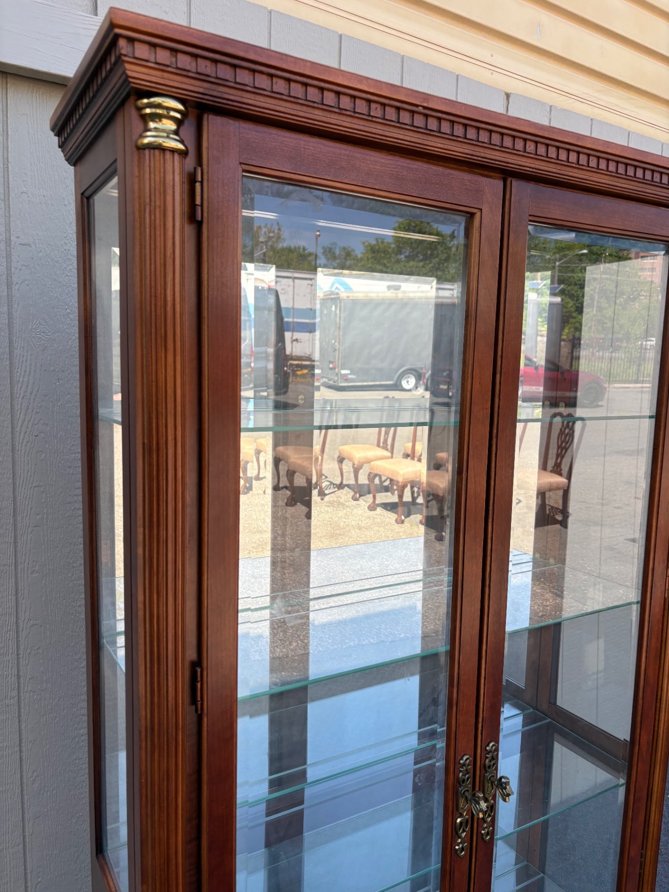 67753 Pulaski Traditional Glass Front Curio Cabinet with Brass Accents