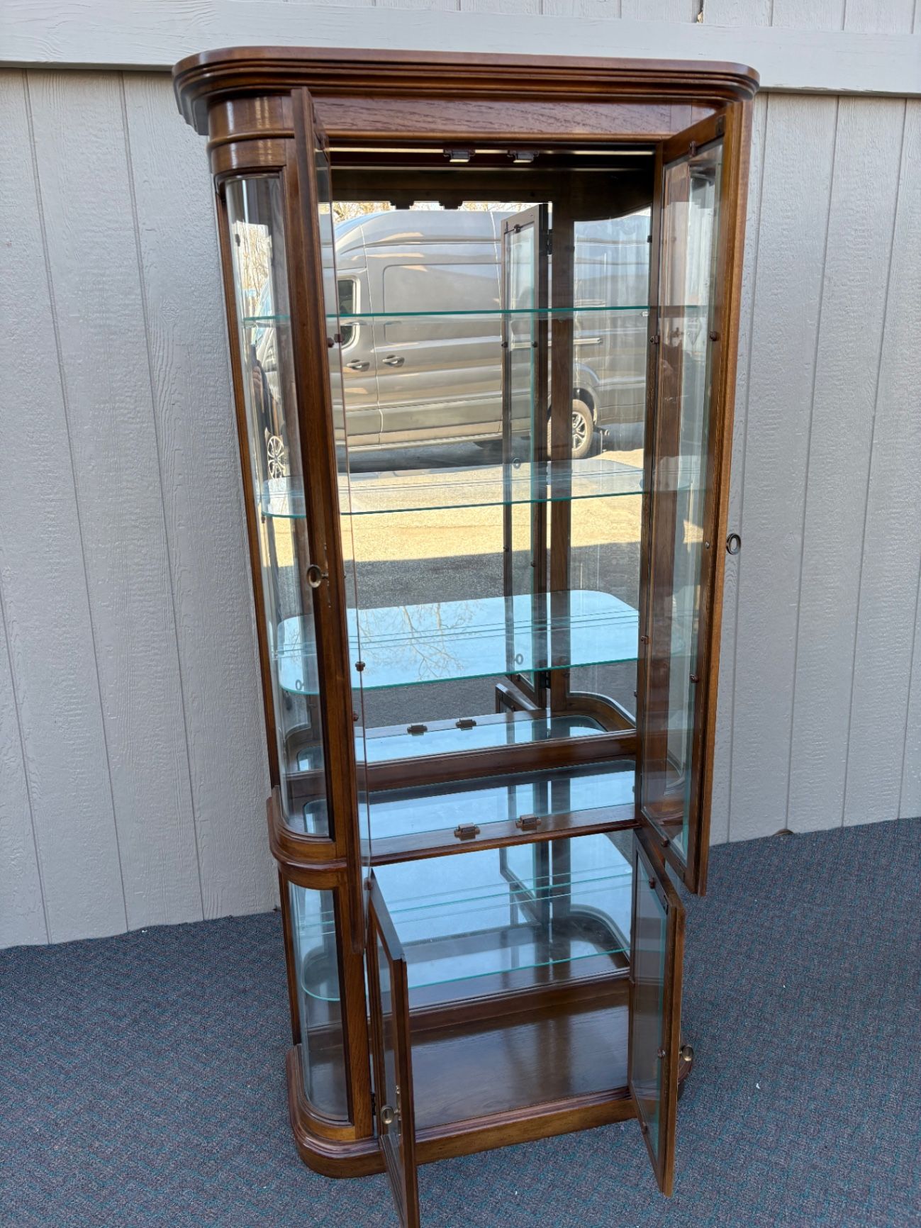 67590 Pulaski Lighted Curio Cabinet with Bowed Glass Doors