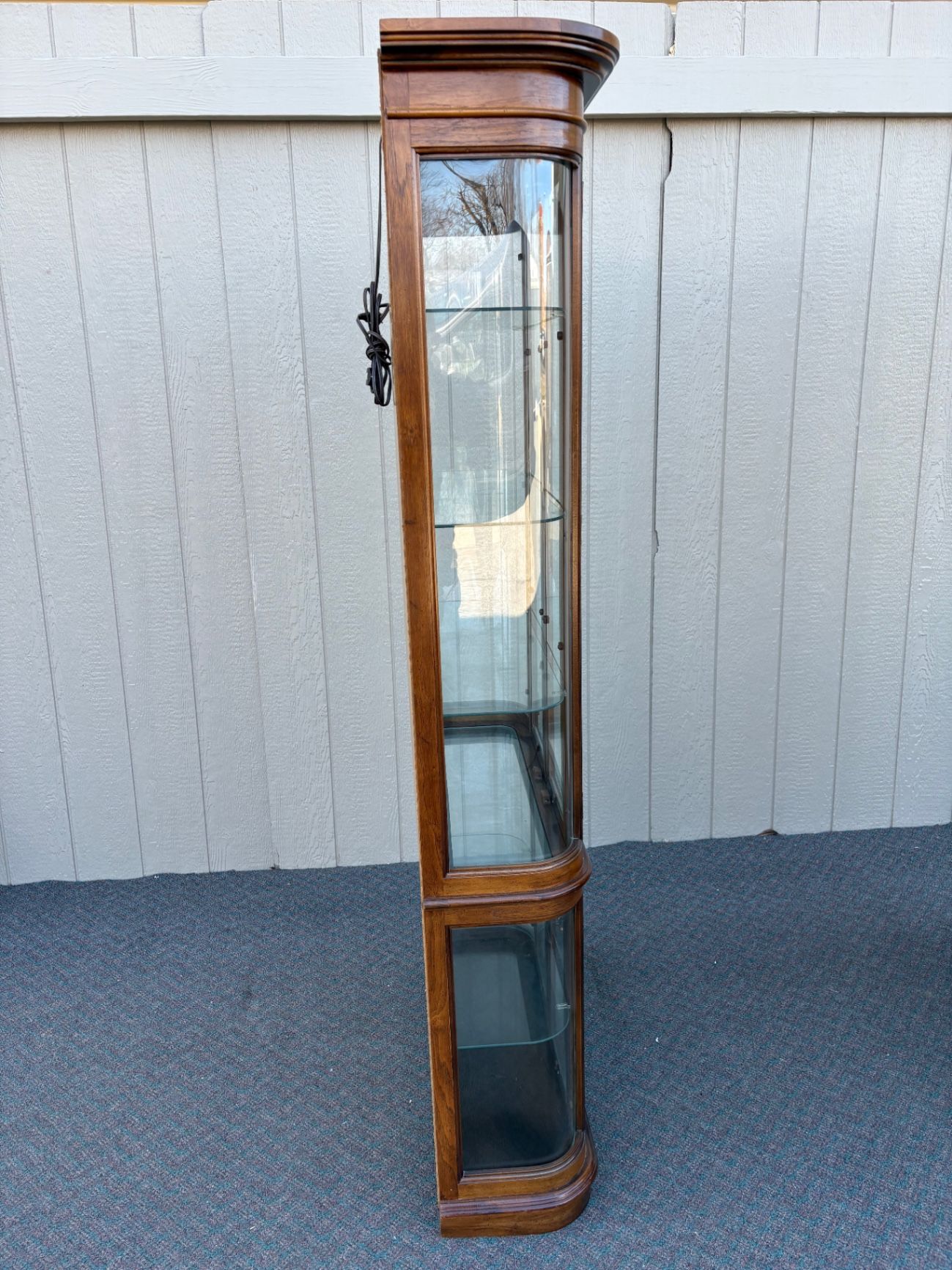 67589  Pulaski Lighted Curio Cabinet with Bowed Glass Doors