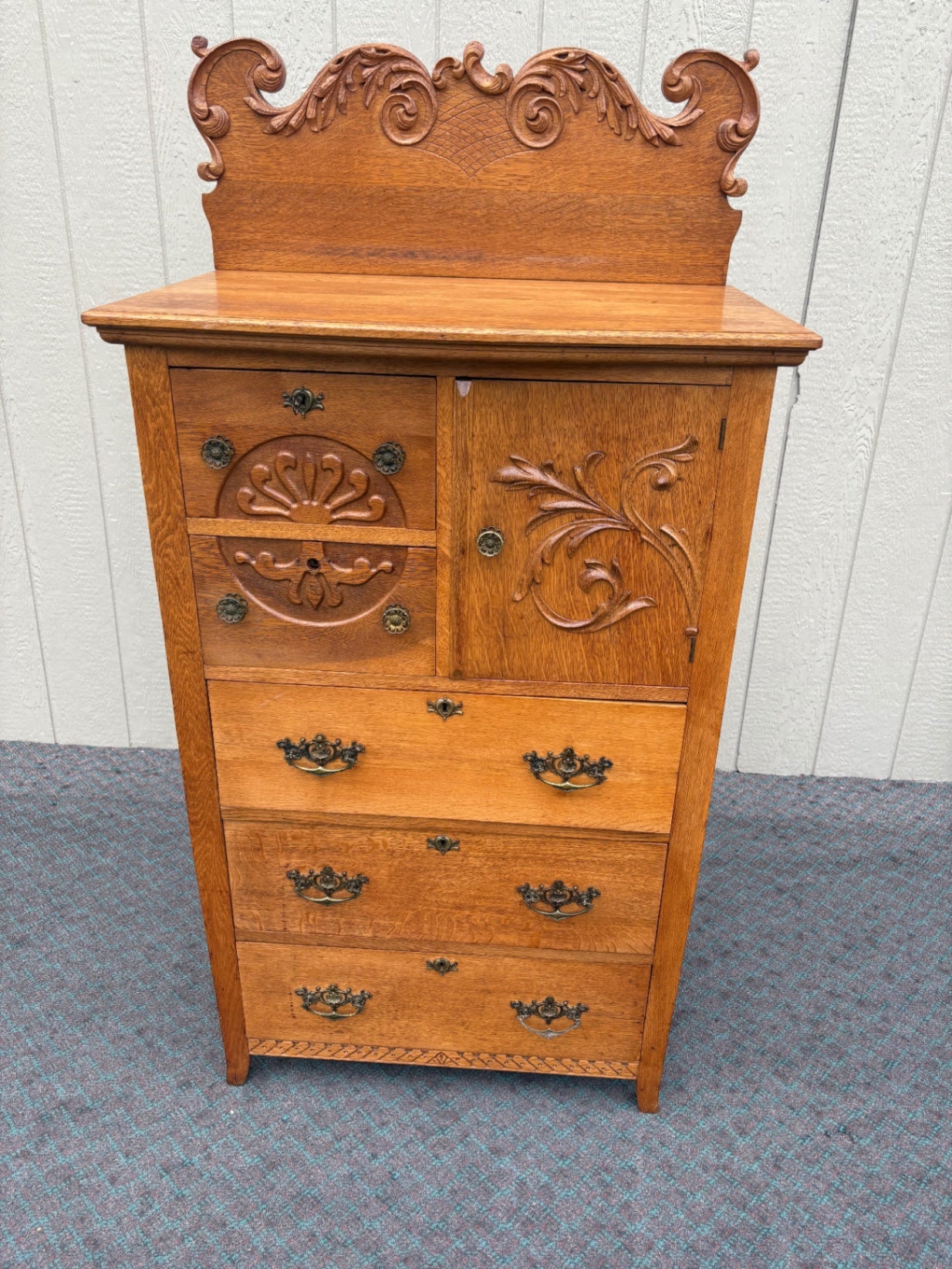 68057  Antique Oak Bonnet Chest with Ornate Carvings and Brass Hardware