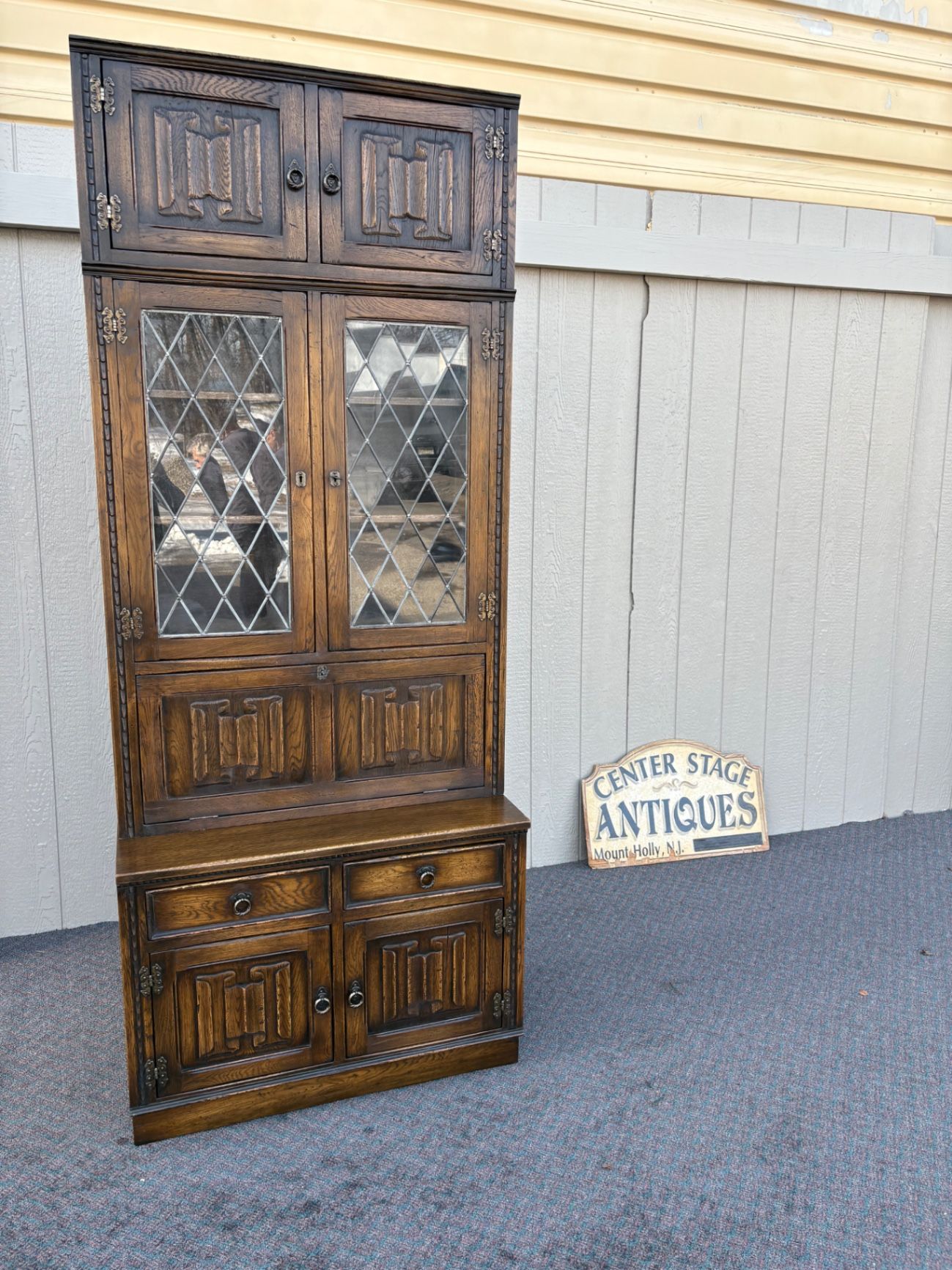 67410  Mid-Century Oak Cabinet with Desk and Leaded Glass Doors