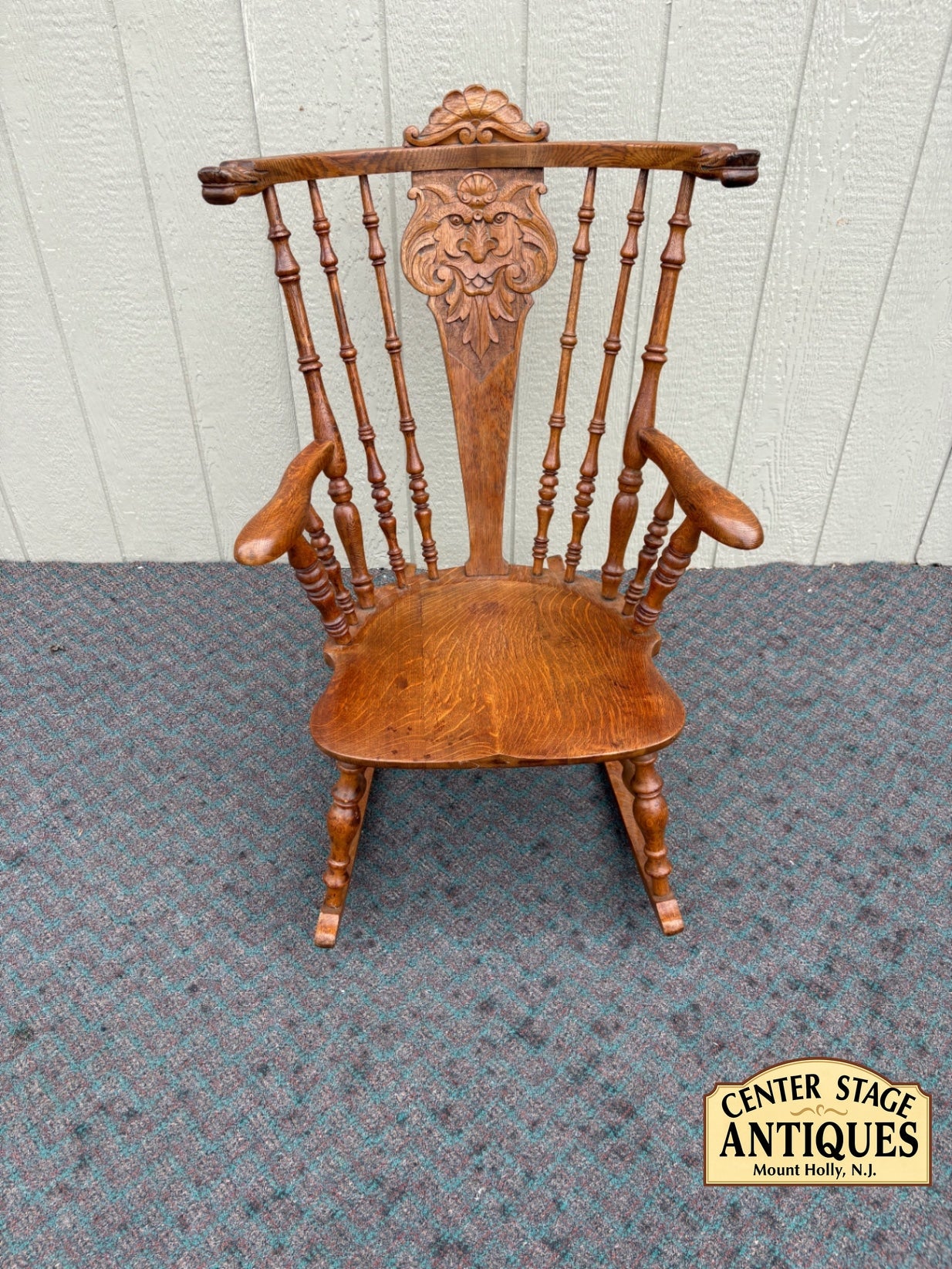 Antique Oak Lion's Head Carved Rocking Chair with Spindle Back