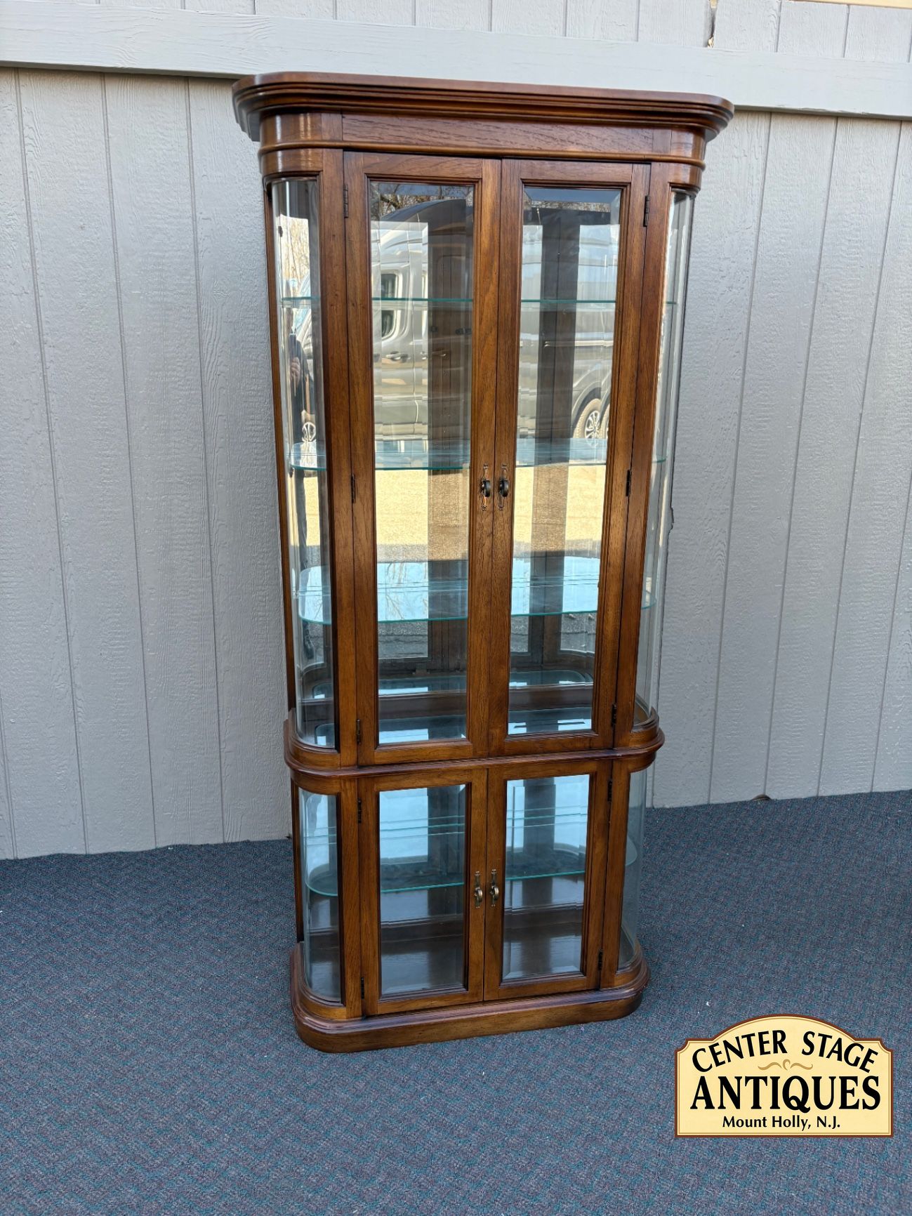 67589  Pulaski Lighted Curio Cabinet with Bowed Glass Doors