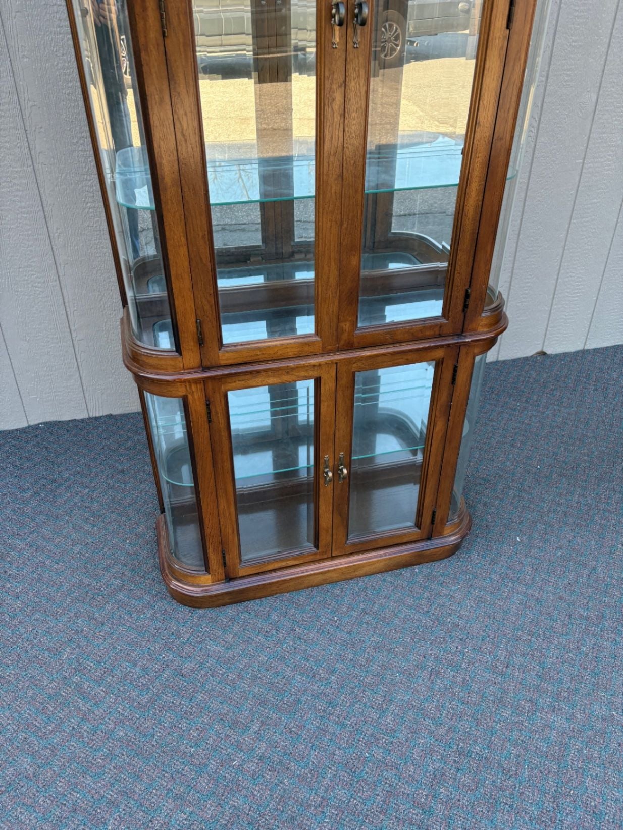 67590 Pulaski Lighted Curio Cabinet with Bowed Glass Doors