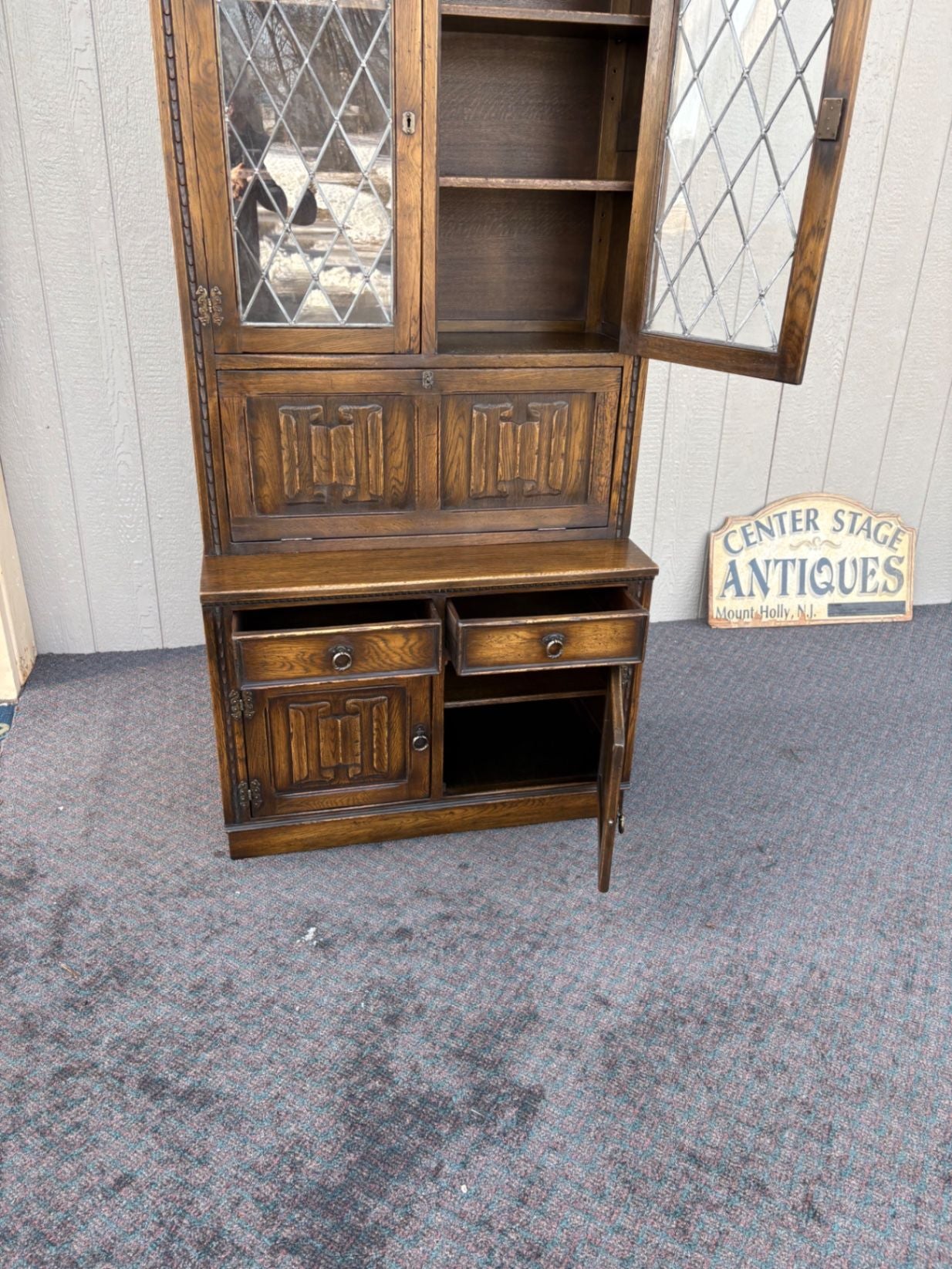 67410  Mid-Century Oak Cabinet with Desk and Leaded Glass Doors
