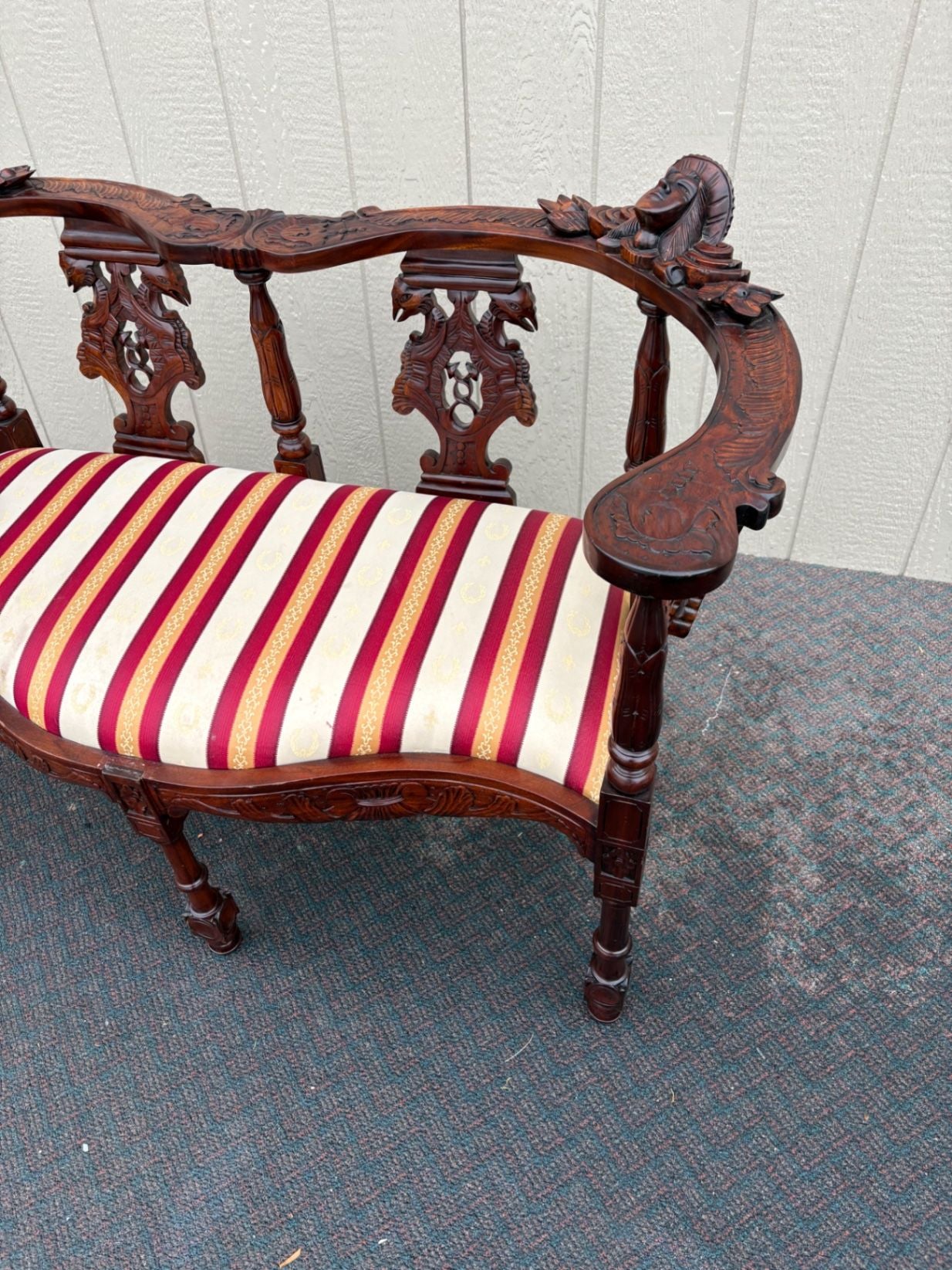 67469  Victorian  Style Carved Mahogany Settee with Figural Details and Upholstery