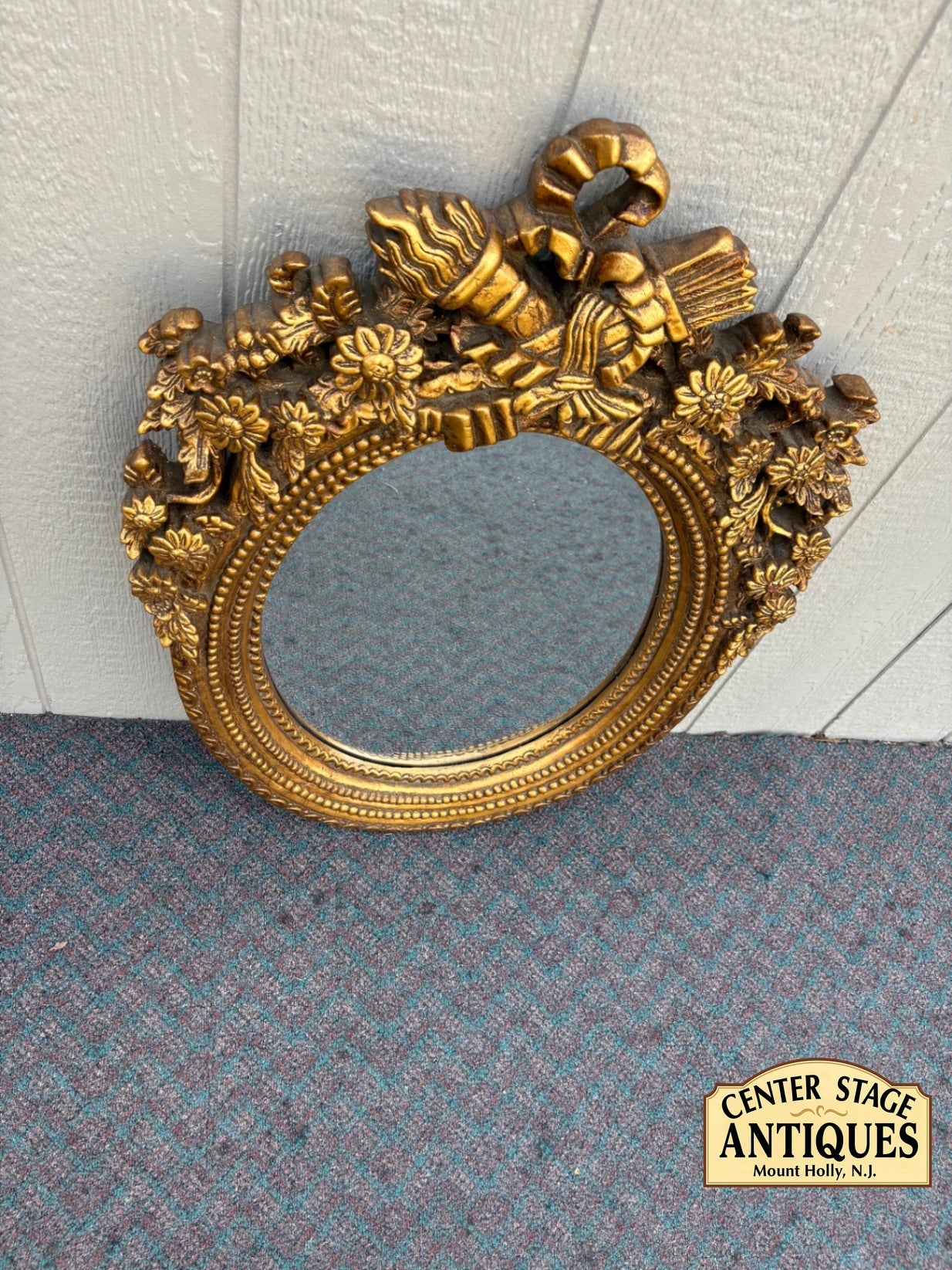 Ornate Gilt Gold Oval Mirror with Floral and Ribbon Details
