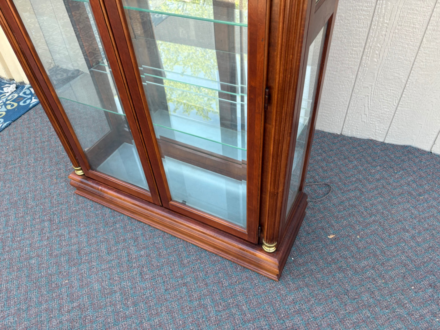 67753 Pulaski Traditional Glass Front Curio Cabinet with Brass Accents