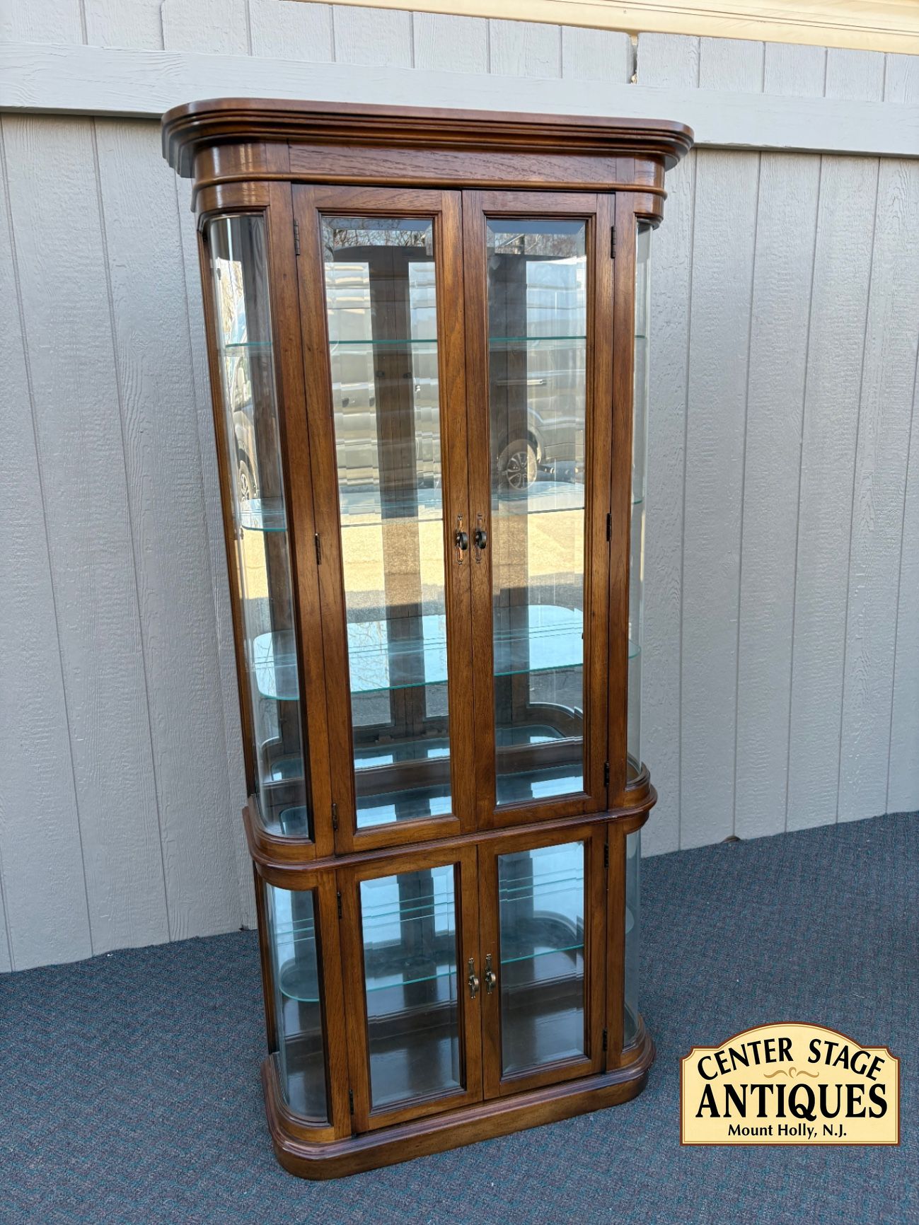 67590 Pulaski Lighted Curio Cabinet with Bowed Glass Doors