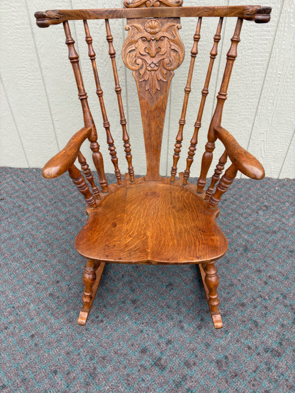 Antique Oak Lion's Head Carved Rocking Chair with Spindle Back