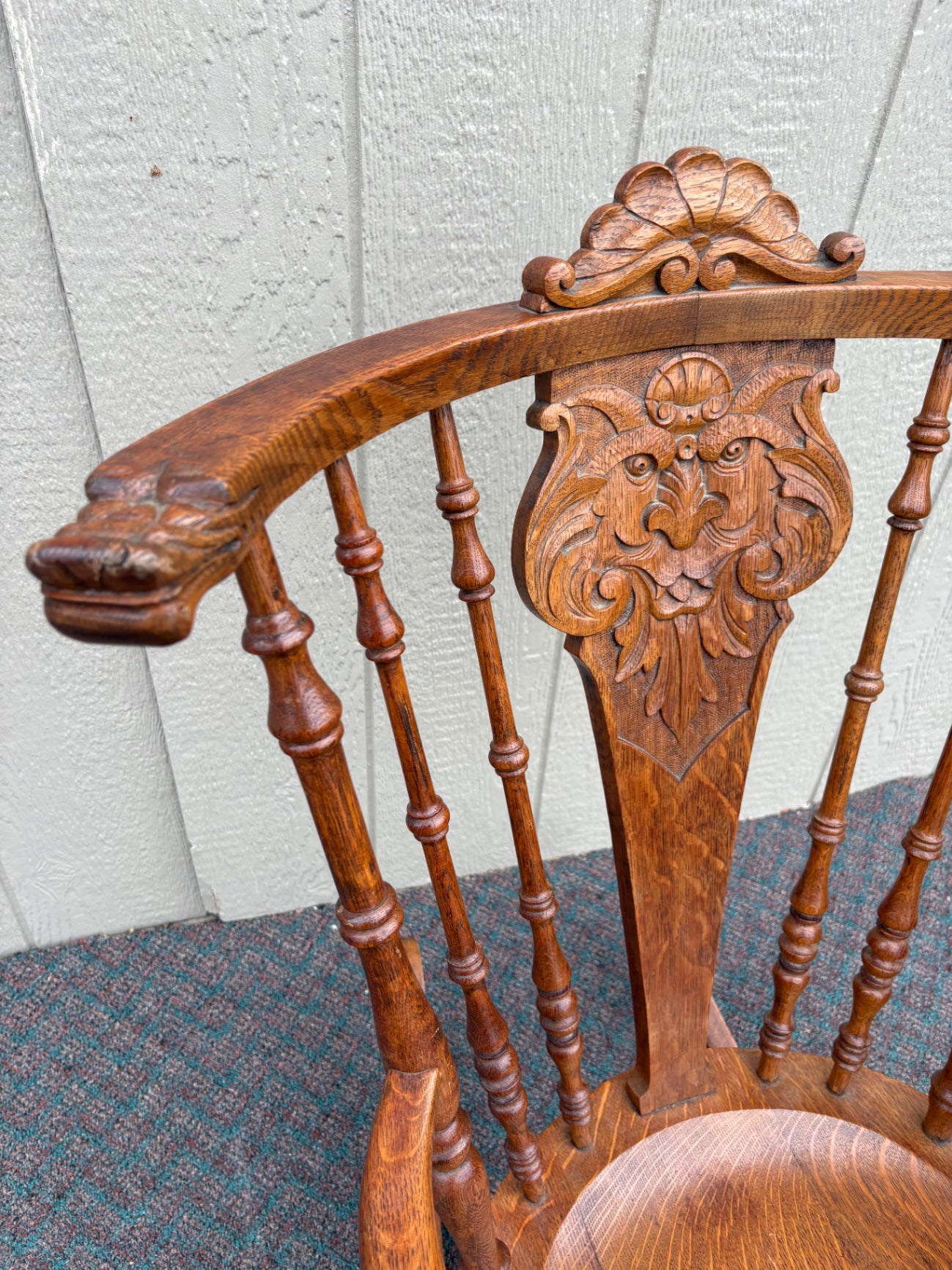 Antique Oak Lion's Head Carved Rocking Chair with Spindle Back