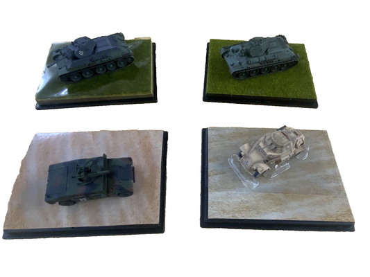 ES 50: Grouping of    4 Miltary  Tanks in Showcase    4 3/4" x 3 3/4" x 2 1/2"H