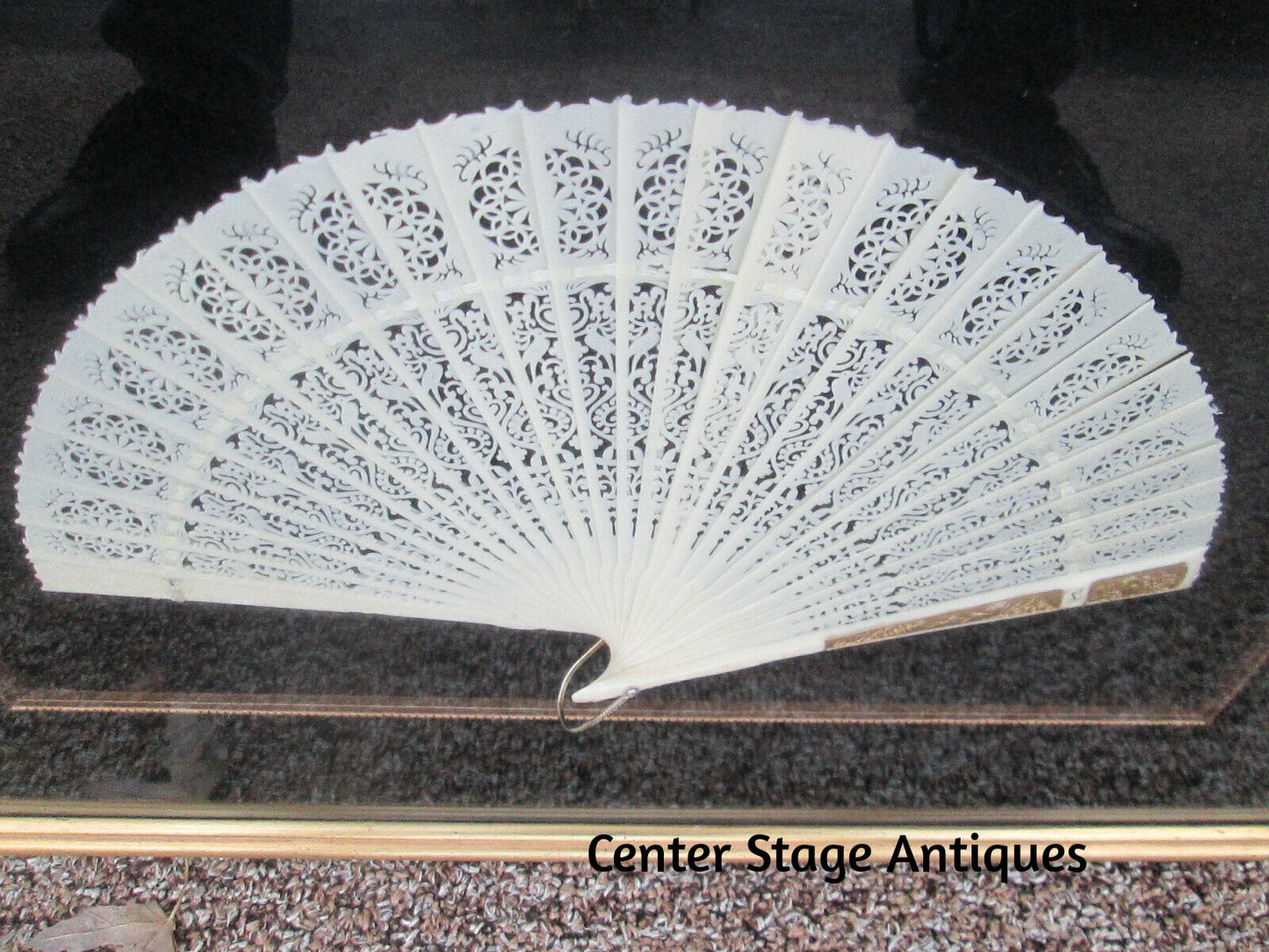 COL 01 CW:    Decorative Celluloid Pierced Carved Fan in Frame