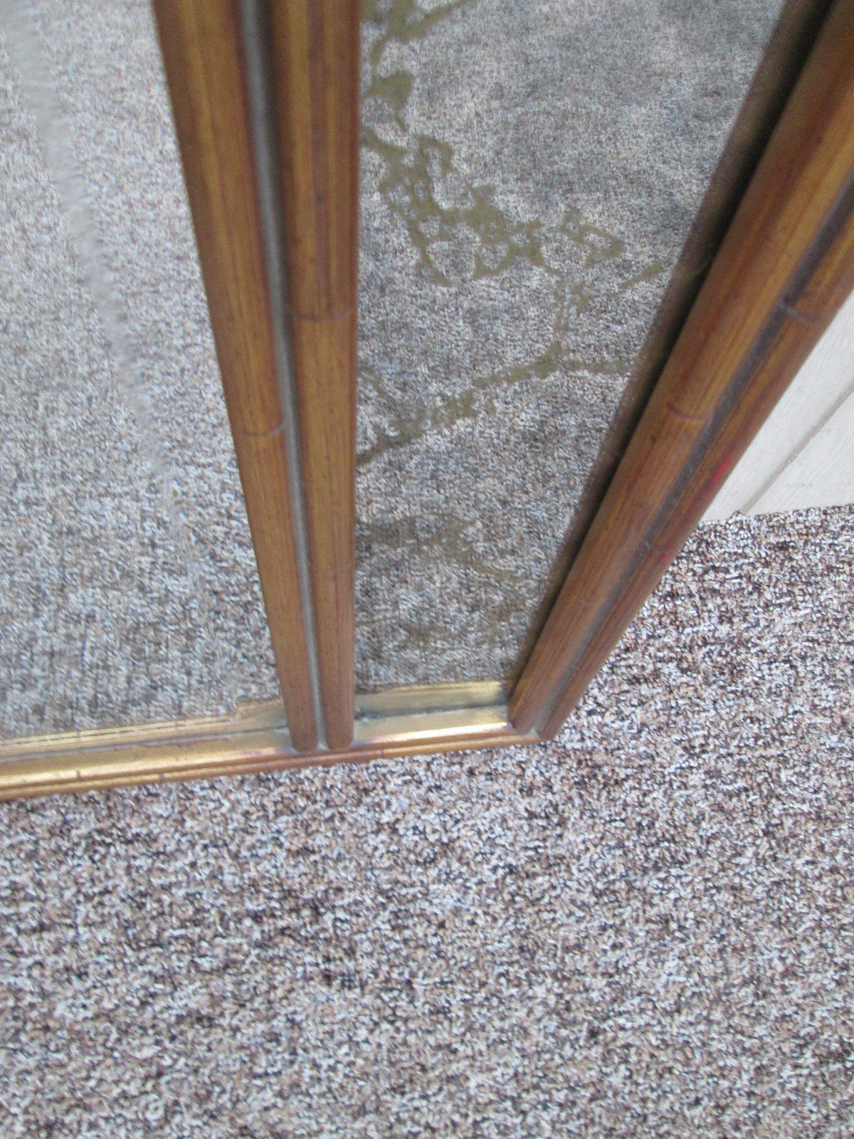 56014  Mid Century Modern Beveled Center Mirror Gold Intertwined mirrors