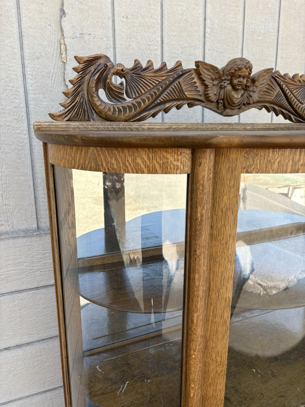 66656   Antique Victorian  Bow Glass Curio Cabinet with Angel Cherub Backsplash