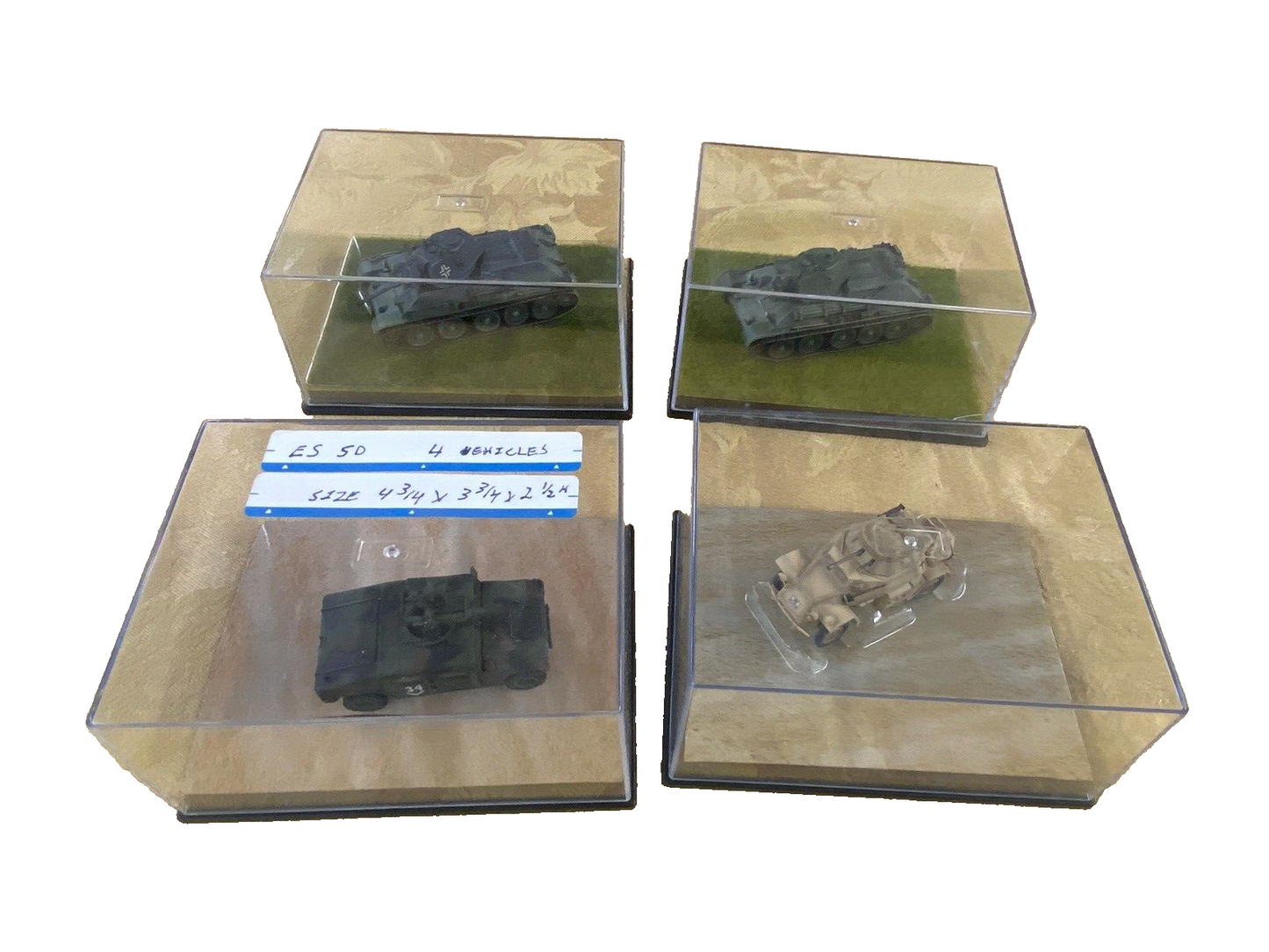 ES 50: Grouping of    4 Miltary  Tanks in Showcase    4 3/4" x 3 3/4" x 2 1/2"H