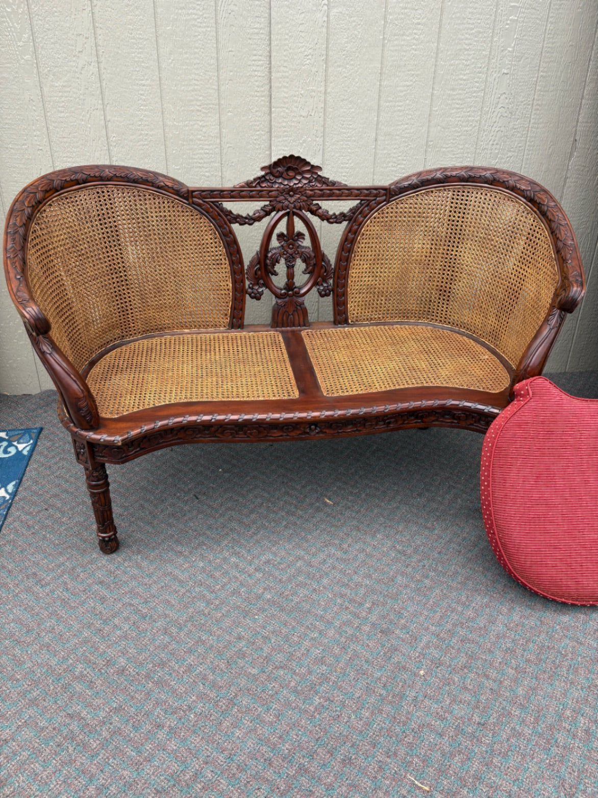 Victorian Carved Wood Settee with Caned Back and Red Cushion