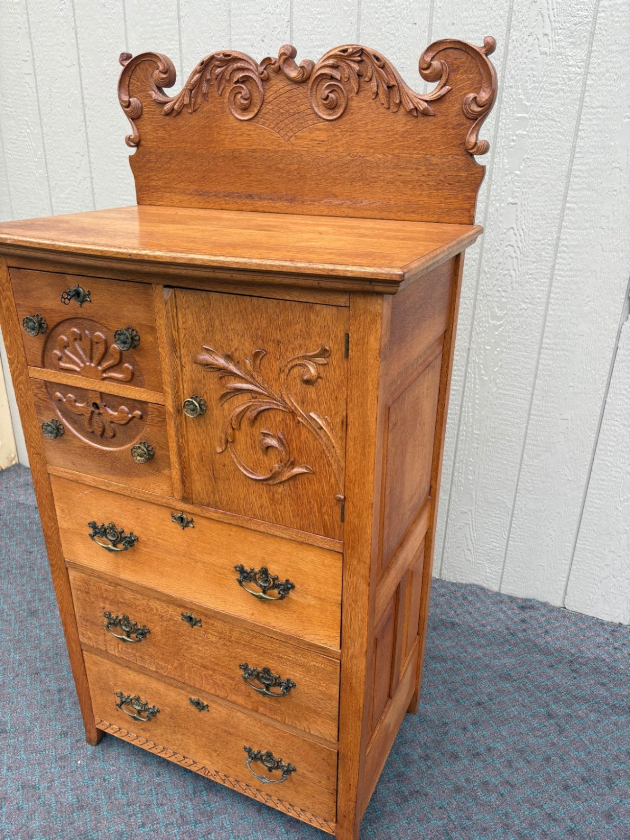 68057  Antique Oak Bonnet Chest with Ornate Carvings and Brass Hardware
