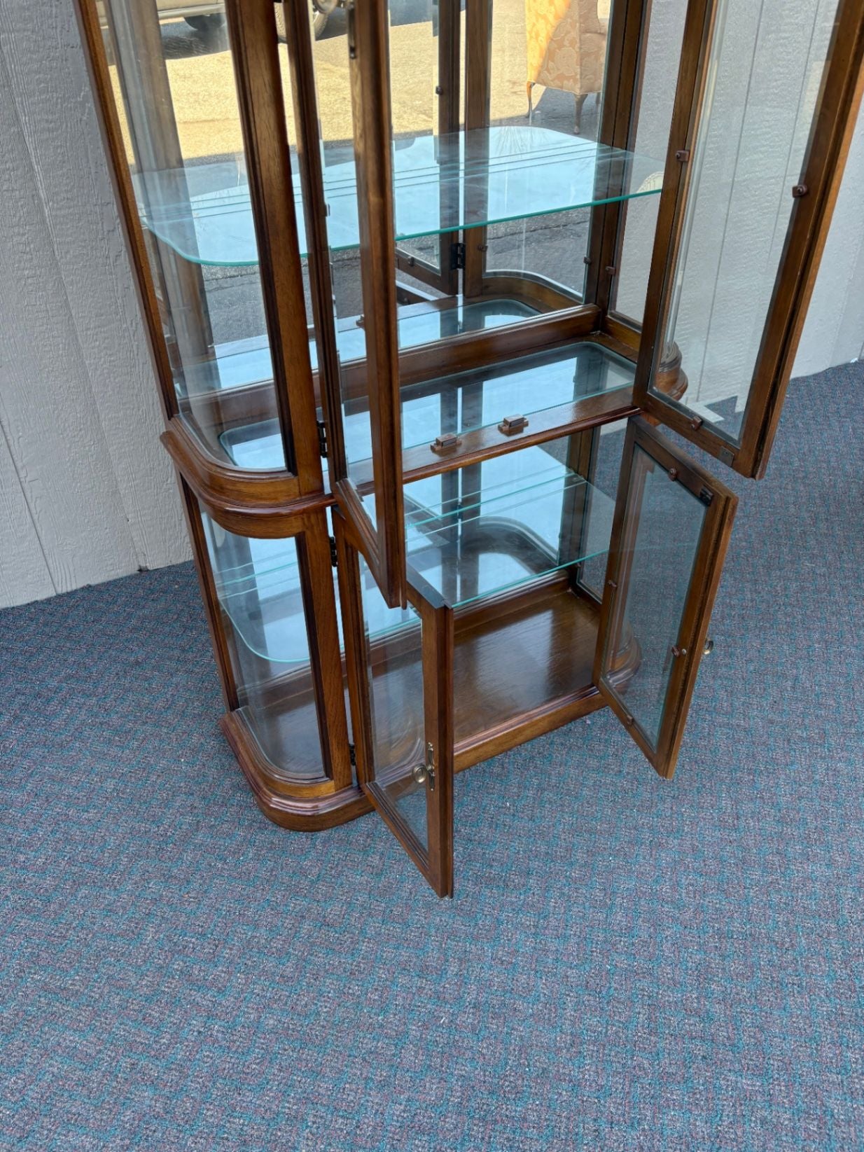 67590 Pulaski Lighted Curio Cabinet with Bowed Glass Doors