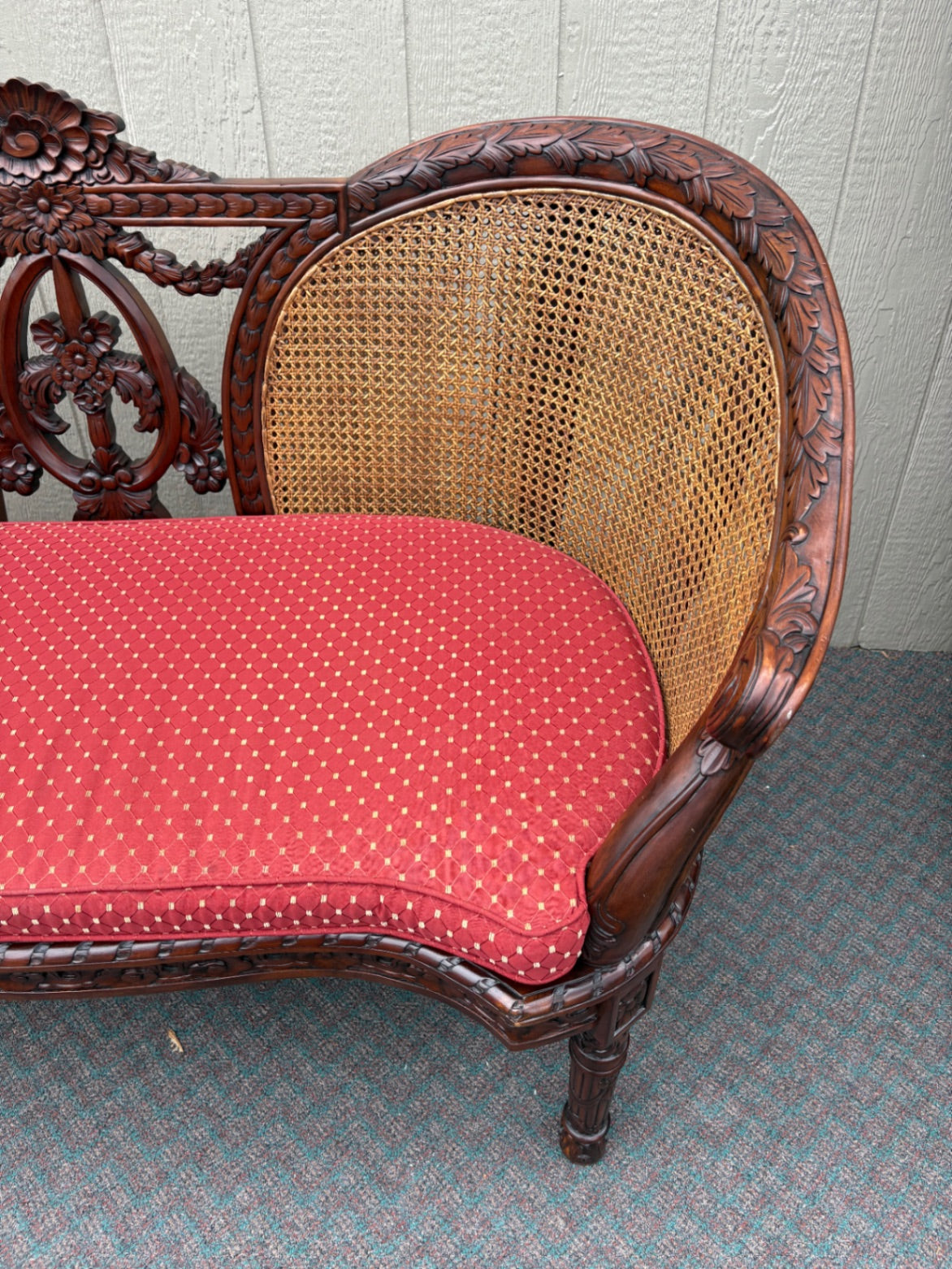 Victorian Carved Wood Settee with Caned Back and Red Cushion