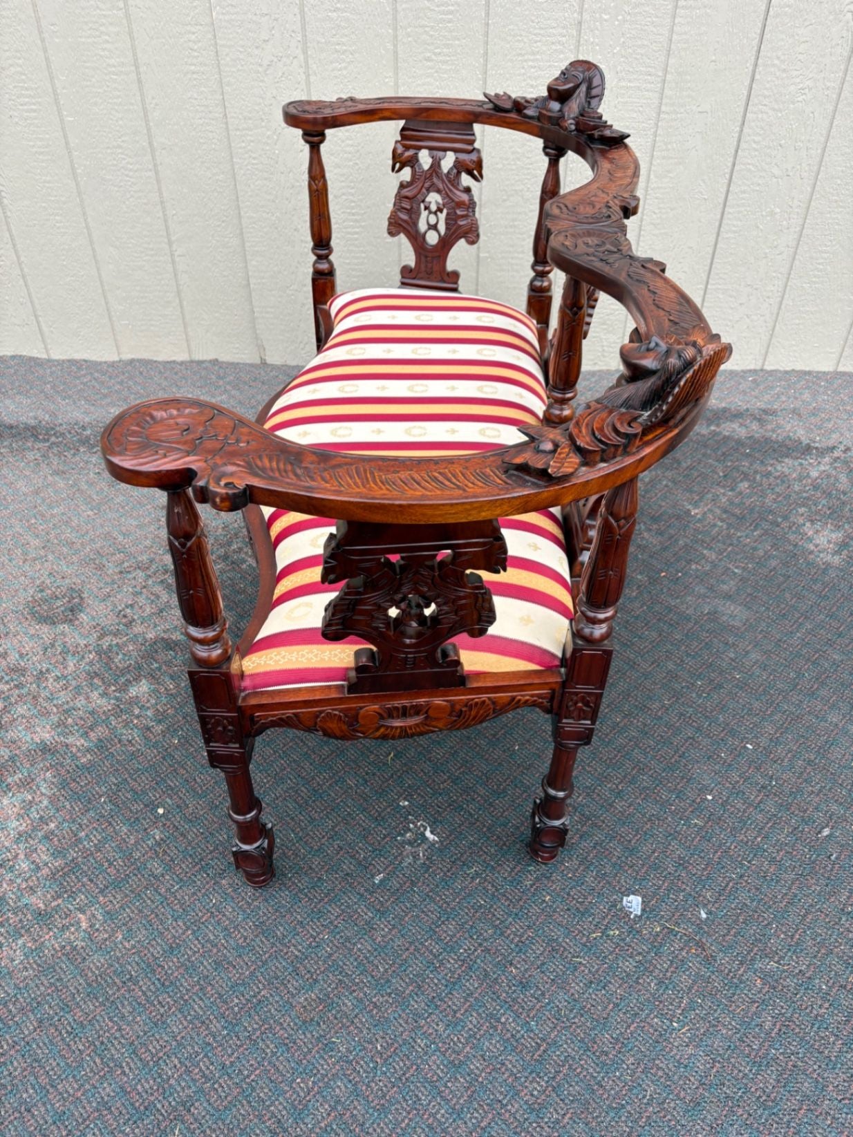 67469  Victorian  Style Carved Mahogany Settee with Figural Details and Upholstery