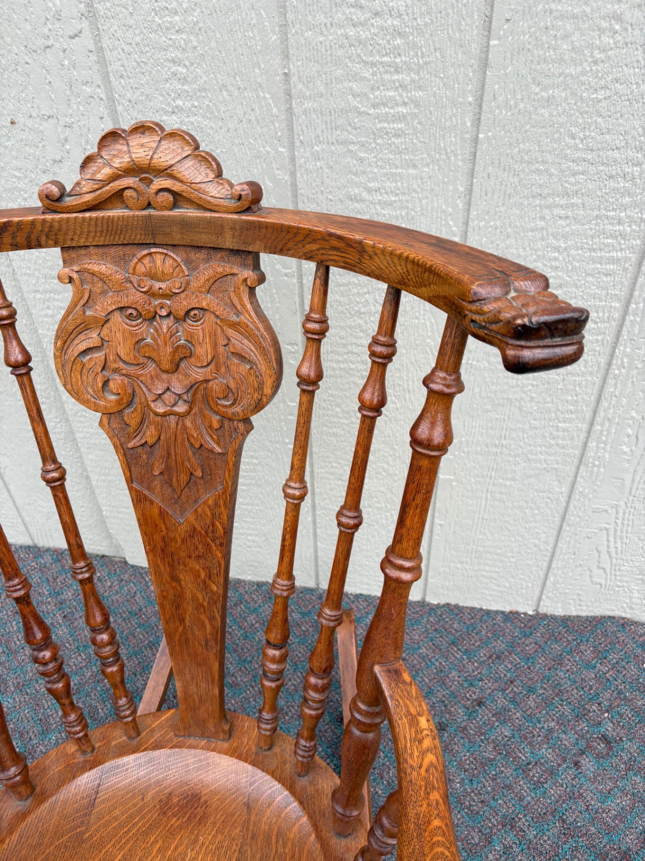 Antique Oak Lion's Head Carved Rocking Chair with Spindle Back
