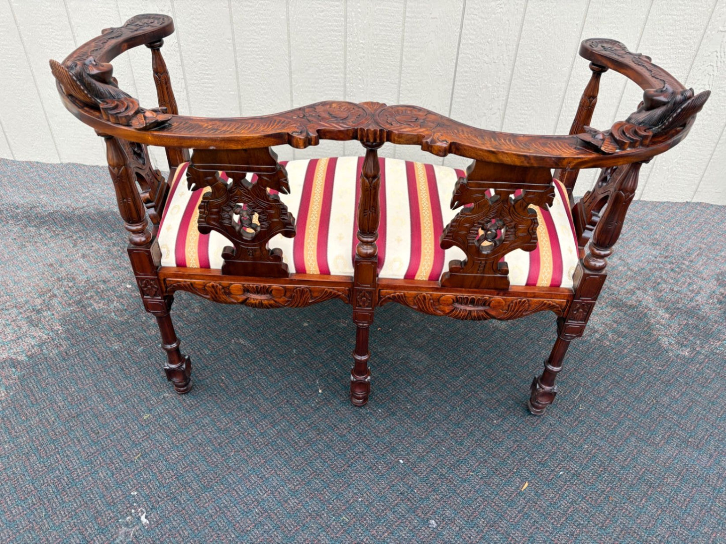 67469  Victorian  Style Carved Mahogany Settee with Figural Details and Upholstery