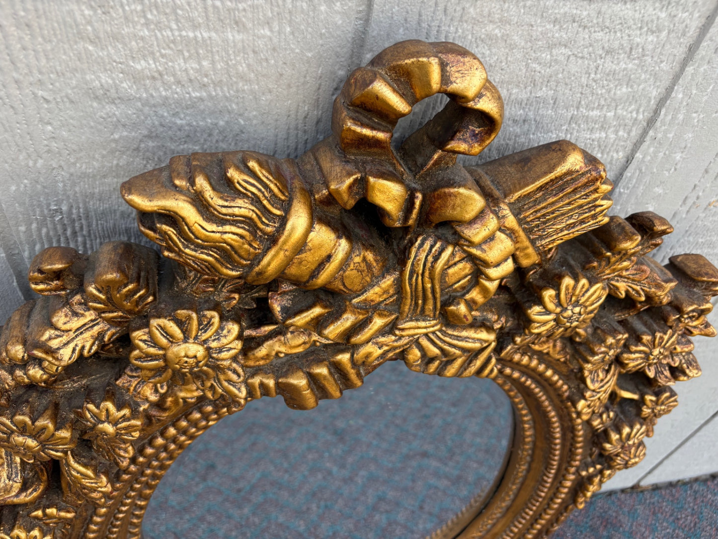 Ornate Gilt Gold Oval Mirror with Floral and Ribbon Details