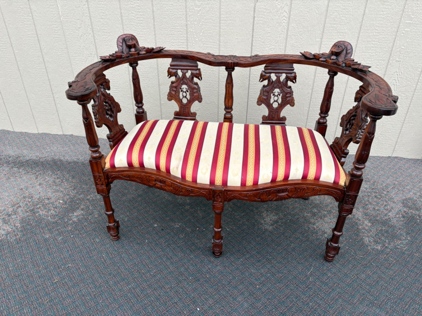 67469  Victorian  Style Carved Mahogany Settee with Figural Details and Upholstery