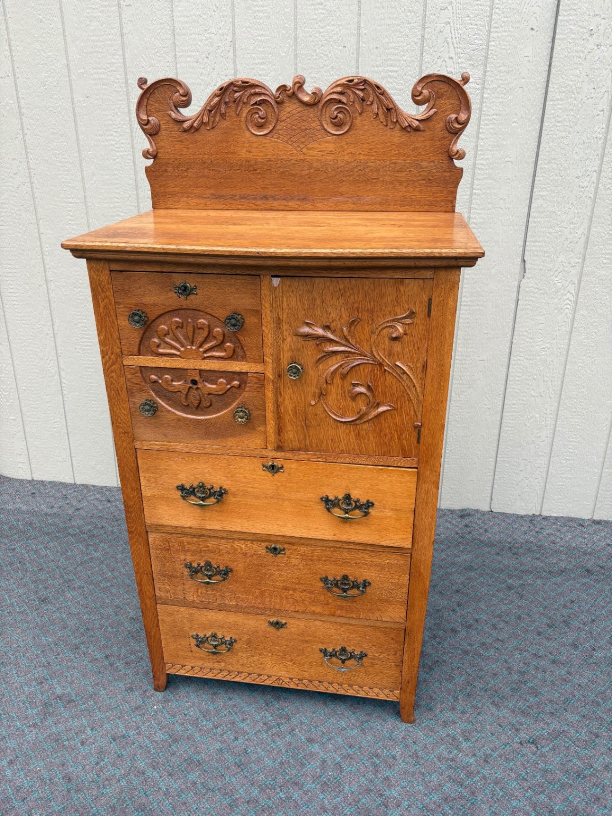 68057  Antique Oak Bonnet Chest with Ornate Carvings and Brass Hardware