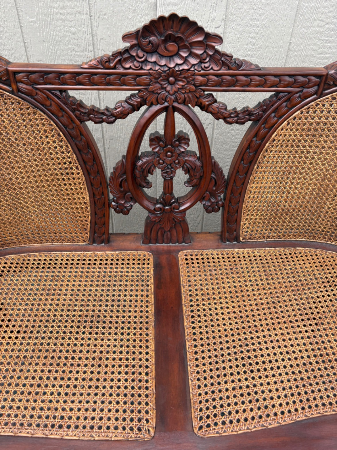 Victorian Carved Wood Settee with Caned Back and Red Cushion