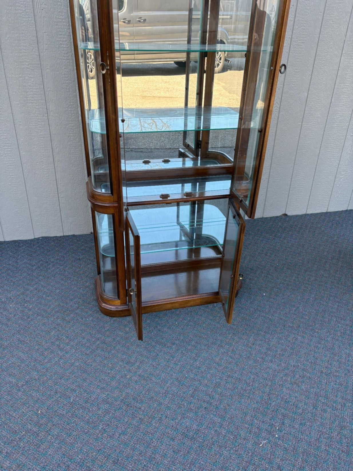 67590 Pulaski Lighted Curio Cabinet with Bowed Glass Doors