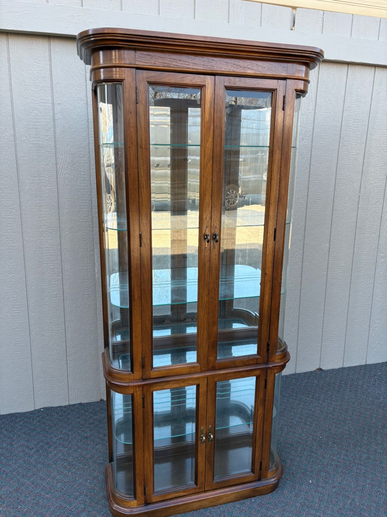 67590 Pulaski Lighted Curio Cabinet with Bowed Glass Doors