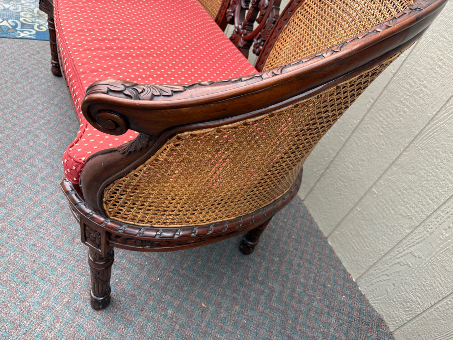 Victorian Carved Wood Settee with Caned Back and Red Cushion